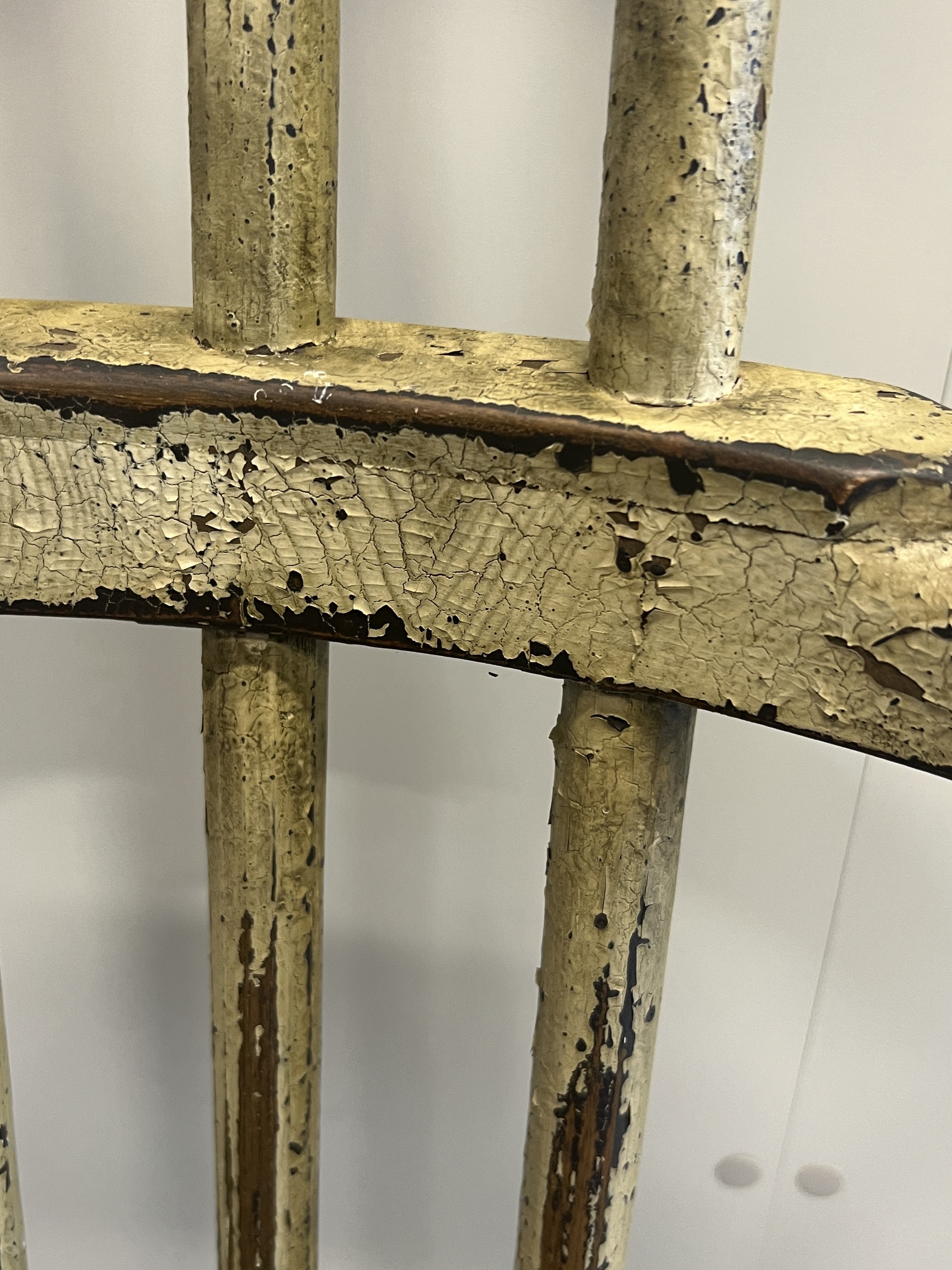 An 18th century style painted hardwood primitive elbow chair, width 68cm, depth 44cm, height 108cm